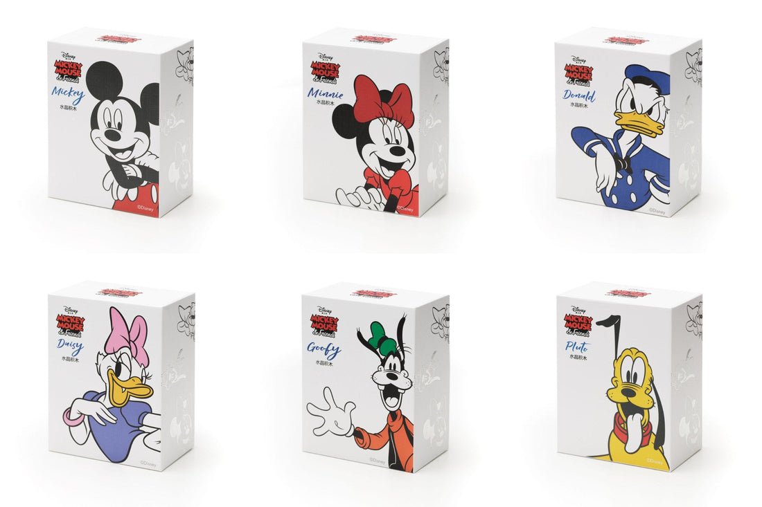 The six MGL Toys Disney Crystal Mickey & Friends figures: Mickey, Minnie, Donald, Daisy, Goofy and Pluto with their boxes