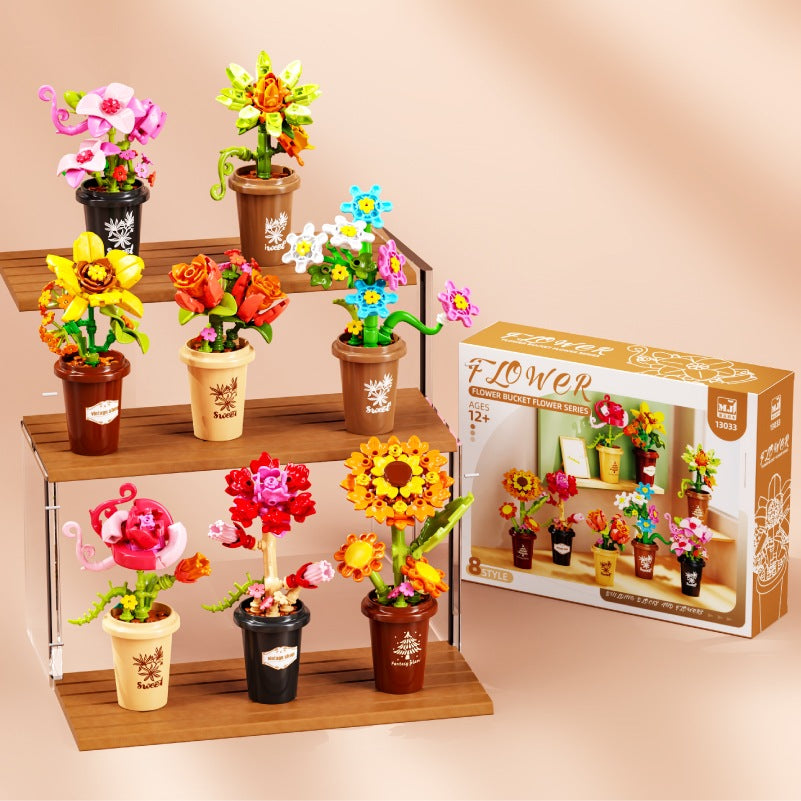 Mini Flower Pots – MJI 13033 botanical building set – retail box beside the 8 pots on a tiered wooden shelf