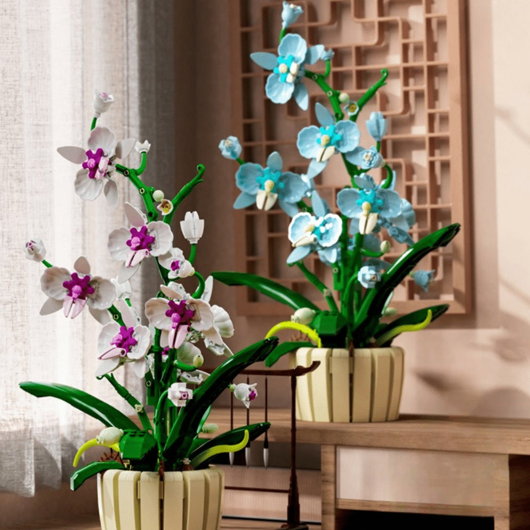 Orchid – MJI 13048 botanical building set – the white/magenta and light-blue builds side by side on a table (one box builds either colour)