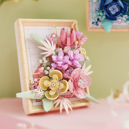 Sunset Crimson Flower Picture Frame – MJI 13062 botanical building set – pink frame on a shelf, green/pink backdrop, blue frame corner visible top right