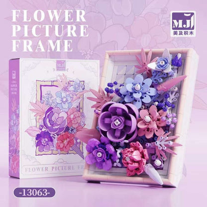 Golden Purple Flower Picture Frame – MJI 13063 botanical building set – retail box beside the assembled purple frame, lilac graphic background