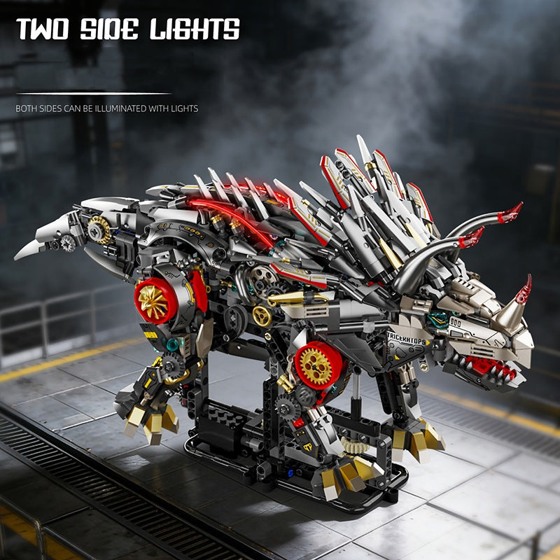 Mechanical Triceratops – MJI 13105 motorised building set – triceratops with the side lights on, smoky backdrop