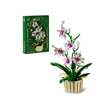 Orchid – MJI 13048 botanical building set – retail box next to the assembled white/magenta orchid, on a white background