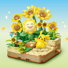 Pikachu and Sunflora – Keeppley K20245 Pokémon building set – assembled model on a blue background