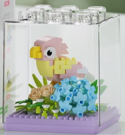 Peach Parrot – MEKANSM K397 micro block set – assembled peach-faced lovebird in the clear dust cover